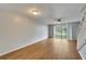 Bright living room with laminate wood floors and sliding doors to balcony at 107 Caldwell Dr # 291, Brandon, FL 33510