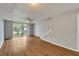 Bright living room with laminate wood floors and sliding doors to balcony at 107 Caldwell Dr # 291, Brandon, FL 33510