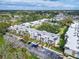 Aerial view of the condo community showcasing its buildings, pool, and parking area at 107 Caldwell Dr # 291, Brandon, FL 33510