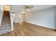 Living room with laminate floors and staircase to upper level at 107 Caldwell Dr # 291, Brandon, FL 33510