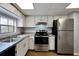 Modern kitchen, updated with stainless steel appliances and granite countertops at 107 Caldwell Dr # 291, Brandon, FL 33510