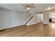 Open living room with laminate flooring, stairs, and kitchen view at 107 Caldwell Dr # 291, Brandon, FL 33510