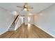 Living room with laminate floors and staircase to upper level at 107 Caldwell Dr # 291, Brandon, FL 33510