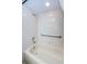 Clean bathroom with tub, shower, and grab bars at 1100 Trafalgar Dr, New Port Richey, FL 34655