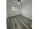 Spacious bedroom with gray vinyl flooring and a large window at 112 Windy Cir, Brandon, FL 33511