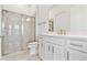 Bathroom features a glass shower, toilet, and dual sink vanity with modern fixtures at 11208 Shoreline Trl, Parrish, FL 34219
