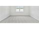 Bright bedroom with neutral carpet and a window letting in natural light at 11208 Shoreline Trl, Parrish, FL 34219