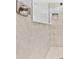 Close up of the shower with sleek fixtures and tiled walls at 11208 Shoreline Trl, Parrish, FL 34219