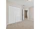 Bedroom with double door closet and access to hallway at 11438 Crestlake Village Dr, Riverview, FL 33569