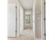 Hallway with neutral walls, carpet, and access to bedrooms at 11438 Crestlake Village Dr, Riverview, FL 33569