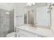 Bathroom featuring shower, toilet, and vanity with solid-surface countertop at 11477 Waterway Dr, Parrish, FL 34219