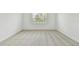Bright bedroom featuring neutral carpeting and a window providing natural light at 11477 Waterway Dr, Parrish, FL 34219