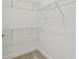 Walk-in closet equipped with multiple metal racks for organization at 11477 Waterway Dr, Parrish, FL 34219