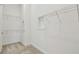 Spacious walk-in closet with metal shelving and lighting at 11477 Waterway Dr, Parrish, FL 34219