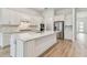 Stylish kitchen featuring white cabinets, stainless steel appliances, spacious countertops, and island at 11477 Waterway Dr, Parrish, FL 34219