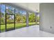 Spacious screened-in patio offers an inviting outdoor living space with views of lush greenery and blue skies at 11477 Waterway Dr, Parrish, FL 34219