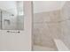 Walk-in shower featuring tile surround, bench, and shower head at 11477 Waterway Dr, Parrish, FL 34219