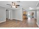 Dining area with wood-look floors and an open view to the kitchen at 11836 106Th Ct, Seminole, FL 33778