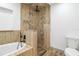 Modern bathroom with soaking tub and walk-in shower, updated fixtures at 12905 N Oregon Ave, Tampa, FL 33612