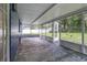 Screened porch with access to backyard at 12905 N Oregon Ave, Tampa, FL 33612