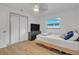 Bedroom with sliding door closet and TV at 12905 N Oregon Ave, Tampa, FL 33612