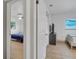Hallway with view into bedrooms and hardwood floors at 12905 N Oregon Ave, Tampa, FL 33612