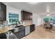 Eat-in kitchen with farmhouse sink, butcher block countertops, and ample cabinet space at 12905 N Oregon Ave, Tampa, FL 33612