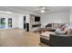 Spacious living room with L-shaped sectional sofa and stone accent wall at 12905 N Oregon Ave, Tampa, FL 33612