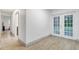Hallway with doors and wood-look floors at 12905 N Oregon Ave, Tampa, FL 33612