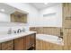 Bathroom features a vanity, soaking tub, and walk-in shower at 12905 N Oregon Ave, Tampa, FL 33612