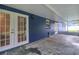 Screened porch with access to backyard at 12905 N Oregon Ave, Tampa, FL 33612