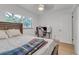 Cozy bedroom with a double bed, desk, and hardwood floors at 12905 N Oregon Ave, Tampa, FL 33612