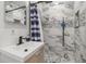 Modern bathroom with marble shower and vanity at 12905 N Oregon Ave, Tampa, FL 33612