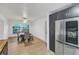 Dining area with wood-look floors and access to the kitchen at 12905 N Oregon Ave, Tampa, FL 33612