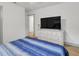 Bright bedroom with large dresser and TV at 12905 N Oregon Ave, Tampa, FL 33612