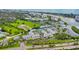 Aerial view of community near canal and road at 14880 Shipwatch Trce # 1915, Largo, FL 33774