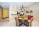 Charming dining room features a glass-top table and wicker chairs at 14880 Shipwatch Trce # 1915, Largo, FL 33774