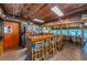 Rustic bar with wood finishes and ample seating at 14880 Shipwatch Trce # 1915, Largo, FL 33774