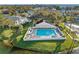 Community pool with surrounding lounge chairs and lush landscaping at 14880 Shipwatch Trce # 1915, Largo, FL 33774