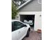 Garage with a white car and a Nissan Frontier at 14880 Shipwatch Trce # 1915, Largo, FL 33774