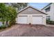 Two-car garage with brick-paved driveway and neutral trim, located at 1007 at 14880 Shipwatch Trce # 1915, Largo, FL 33774