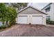 Two-car garage with brick paver driveway at 14880 Shipwatch Trce # 1915, Largo, FL 33774