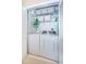Laundry room with washer, dryer, and ample shelving at 14880 Shipwatch Trce # 1915, Largo, FL 33774