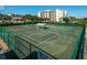 Community tennis courts with seating area at 14880 Shipwatch Trce # 1915, Largo, FL 33774