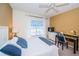 Bedroom with queen bed, desk, and ceiling fan at 14880 Shipwatch Trce # 1915, Largo, FL 33774