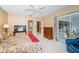 Bedroom with a queen-size bed, dresser, and private balcony access at 14880 Shipwatch Trce # 1915, Largo, FL 33774