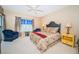 Spacious bedroom with a comfortable bed and plenty of natural light at 14880 Shipwatch Trce # 1915, Largo, FL 33774