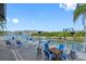 Outdoor patio with water views, seating, and heaters at 14880 Shipwatch Trce # 1915, Largo, FL 33774