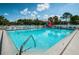 Refreshing community pool with plenty of lounge chairs at 14880 Shipwatch Trce # 1915, Largo, FL 33774