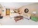 Bright living room with comfy sofas and a view into the kitchen at 14880 Shipwatch Trce # 1915, Largo, FL 33774